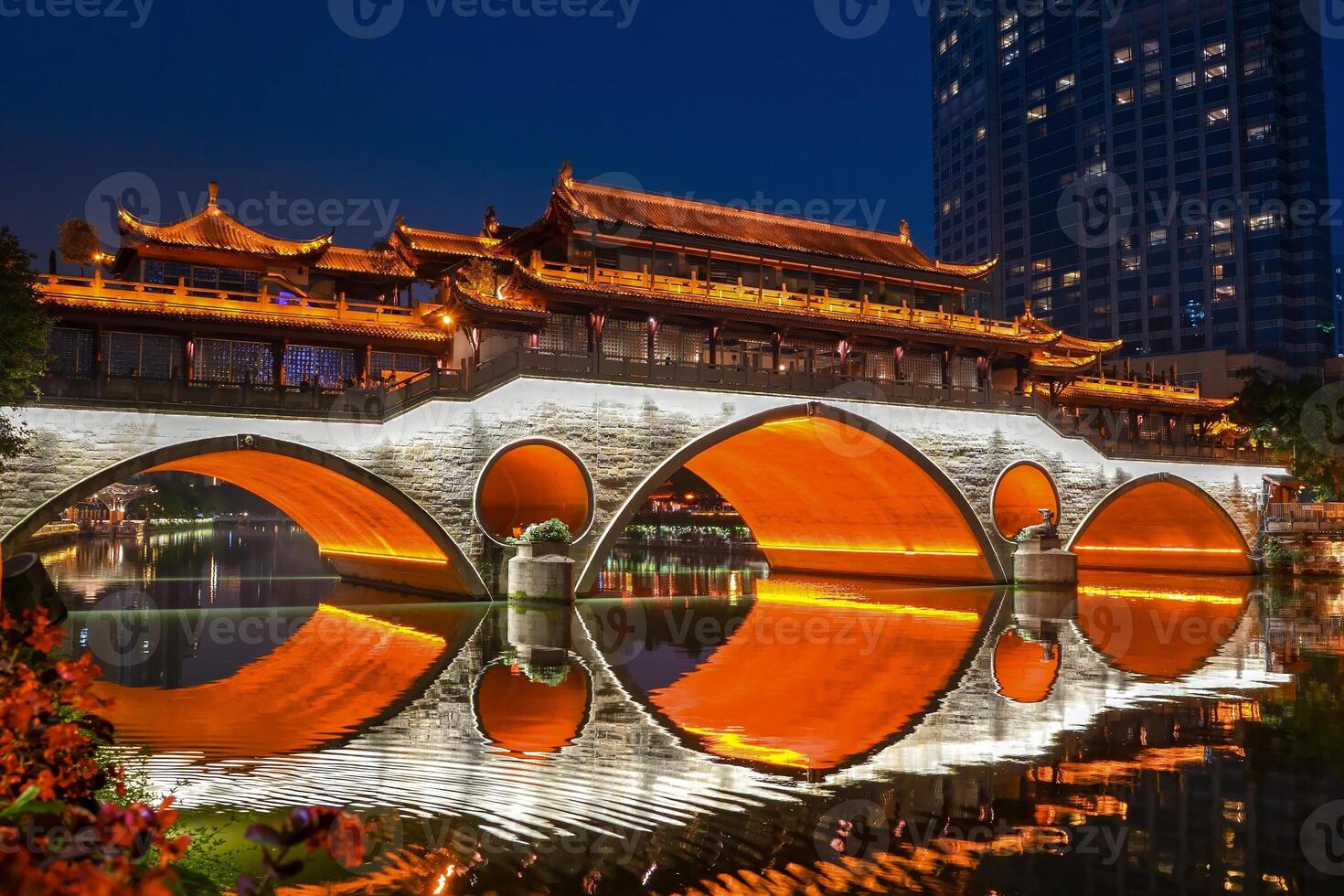 Night view of Anshun Lang Bridge with beautiful illumination and reflection in Chengdu, China photo