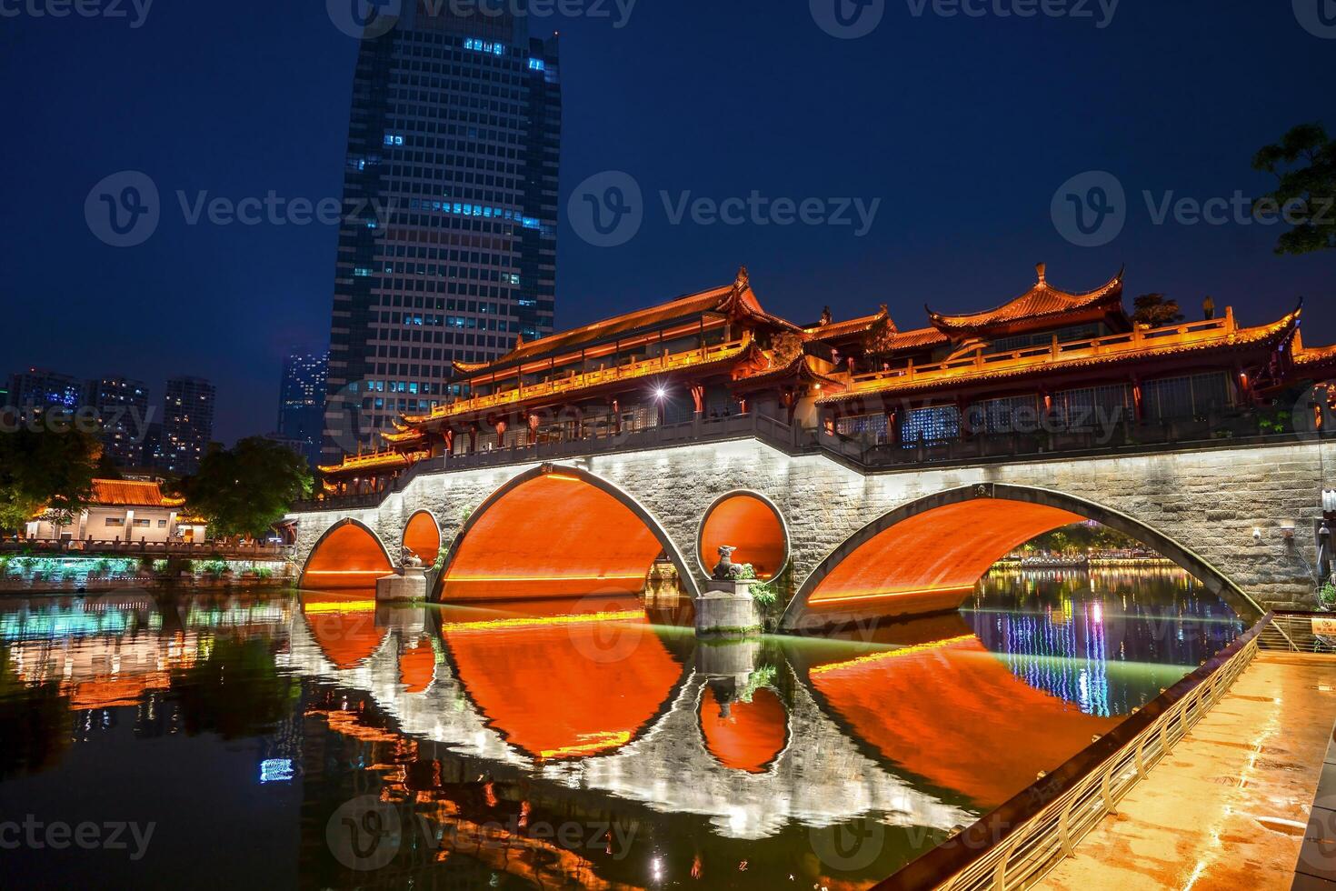Night view of Anshun Lang Bridge with beautiful illumination and reflection in Chengdu, China photo