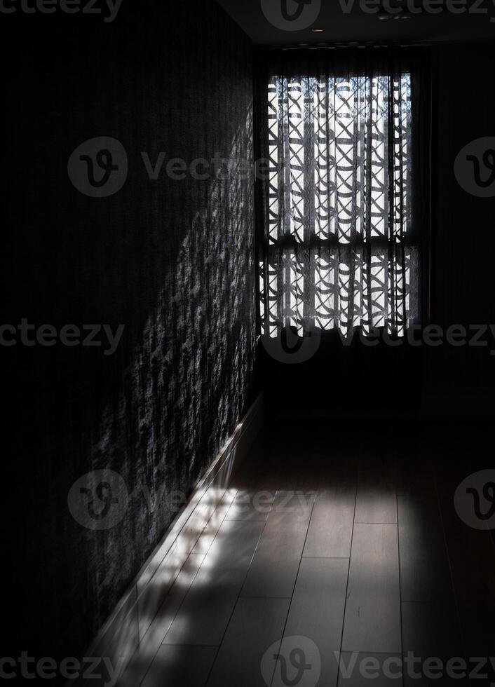 Dark room with patterned curtains photo