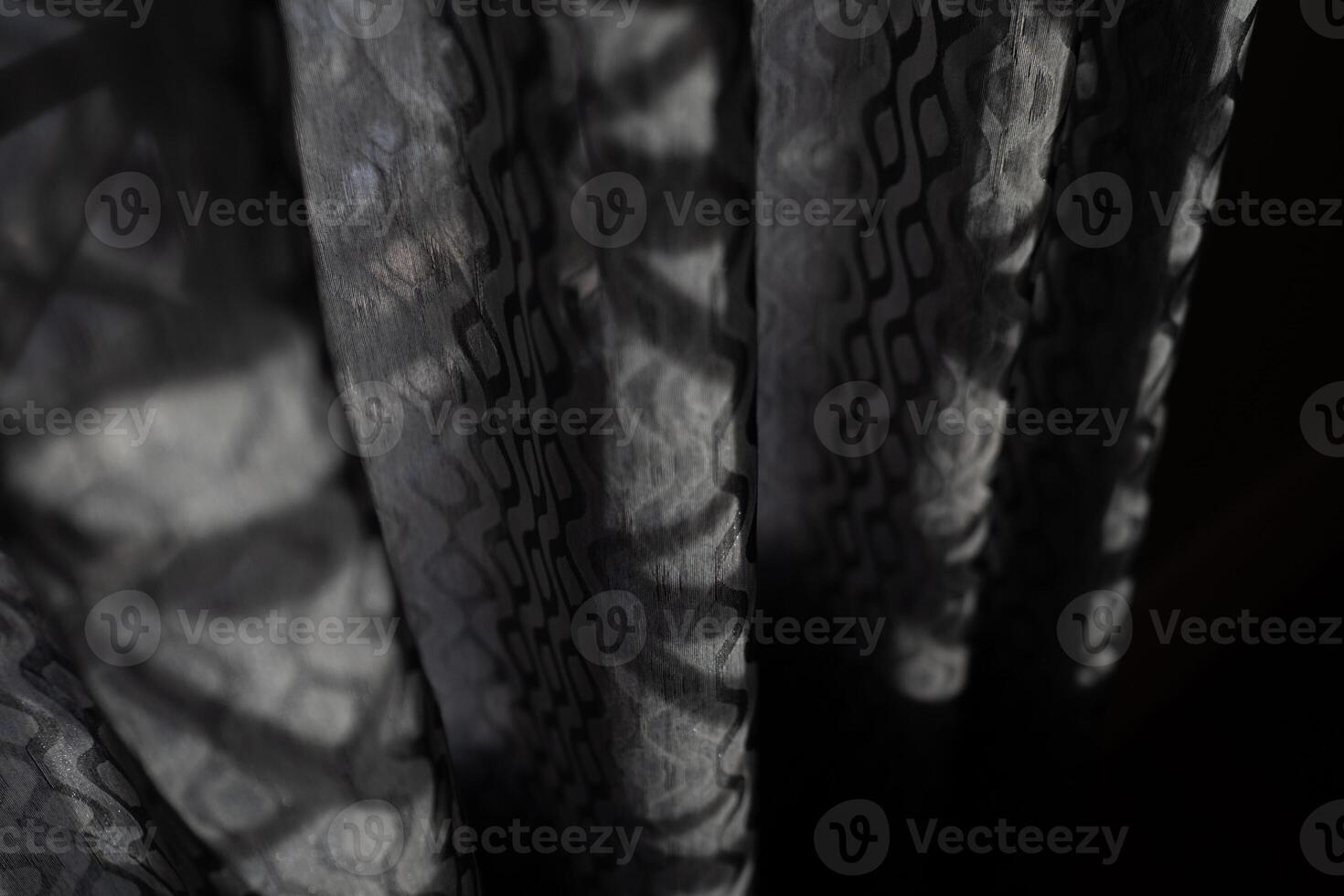 Shadow pattern on grey curtain photo