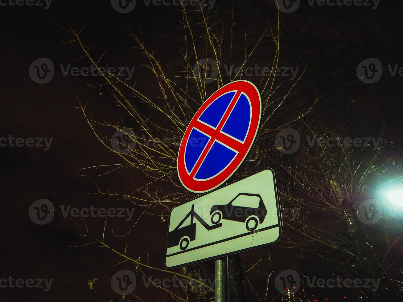 No parking any time punishment symbol, evacuation of car. photo
