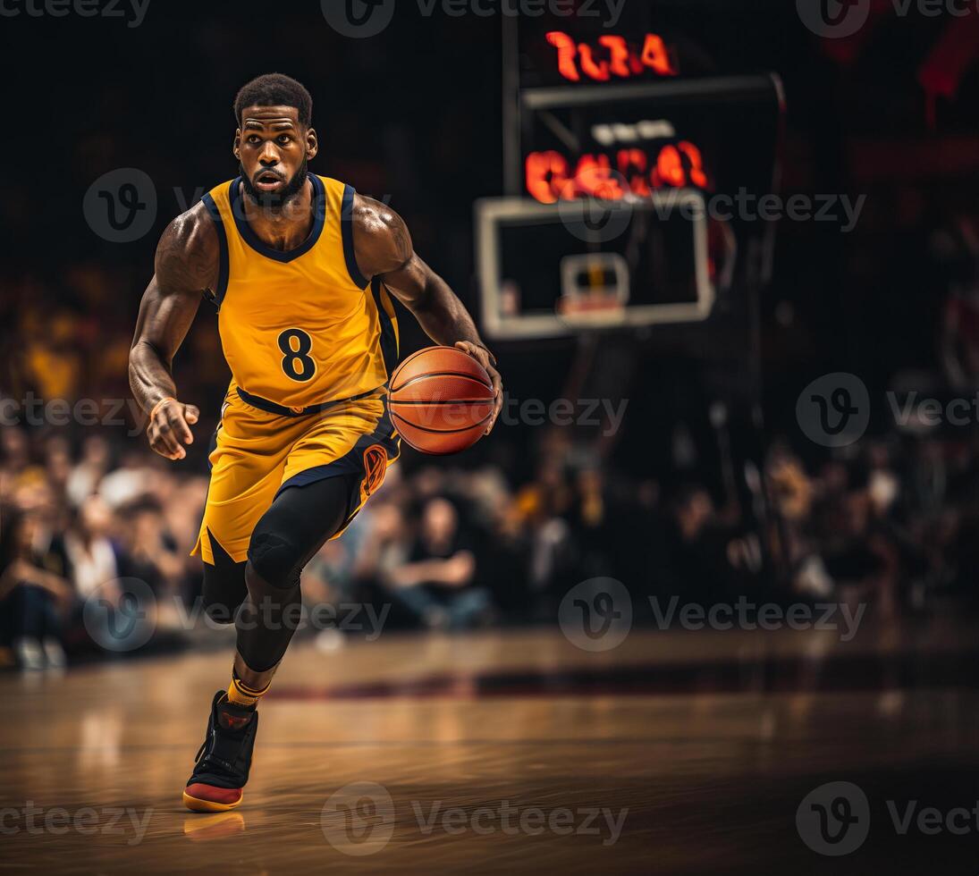 A basketball player in a yellow uniform runs with a ball on the parquet of a basketball arena photo