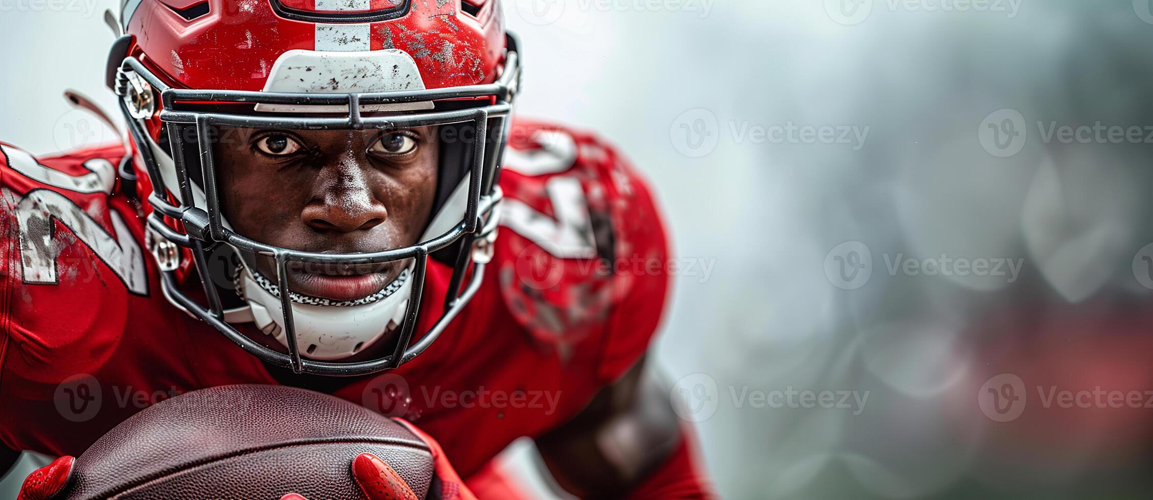 An American football player in a red uniform runs with a ball in his hands during a match. Place for the text on the right photo