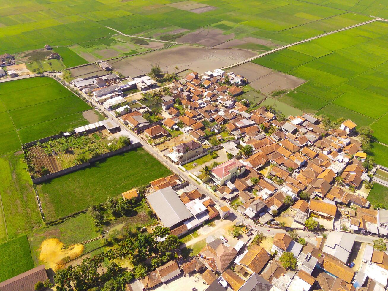 Aerial Photography. Aerial Drone view of landscape view of residential district on the edge of rice fields in Gunung Pangradinan, Cikancung - Bandung, Indonesia. View of the residential district photo