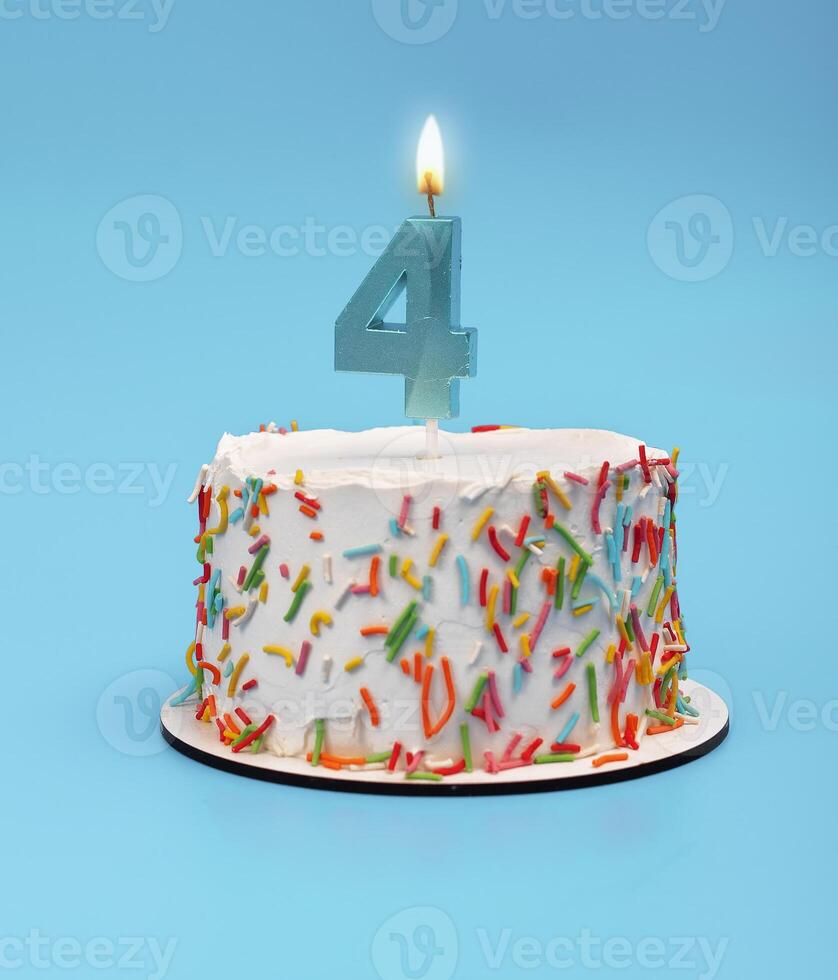 Cake with four candles for 4th birthday party. Happy celebration with blue white background. photo