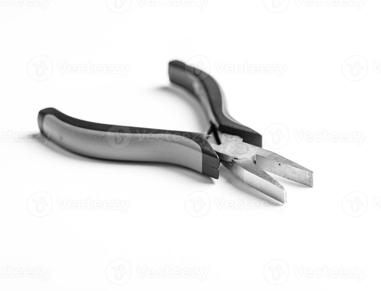 Pliers tool and metal equipment, handle steel white background work object. Industrial repair photo