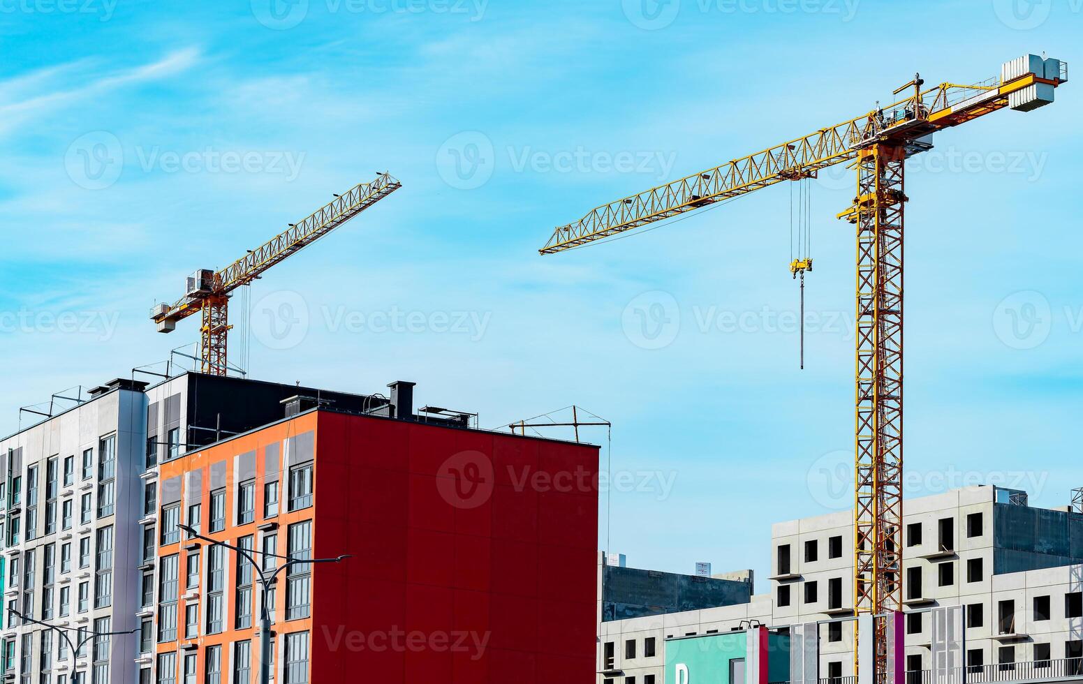 Urban construction site with crane. Modern city architecture, building apartment. Blue industry photo