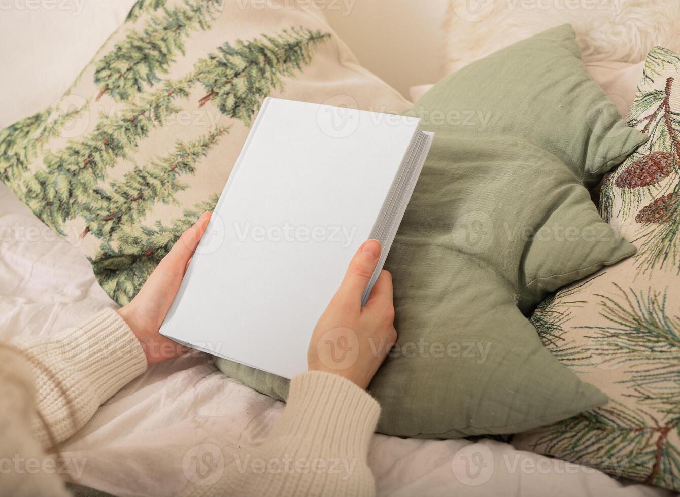 Blank book mockup with cover. Hand holding white paper template. Woman s background design for empty photo