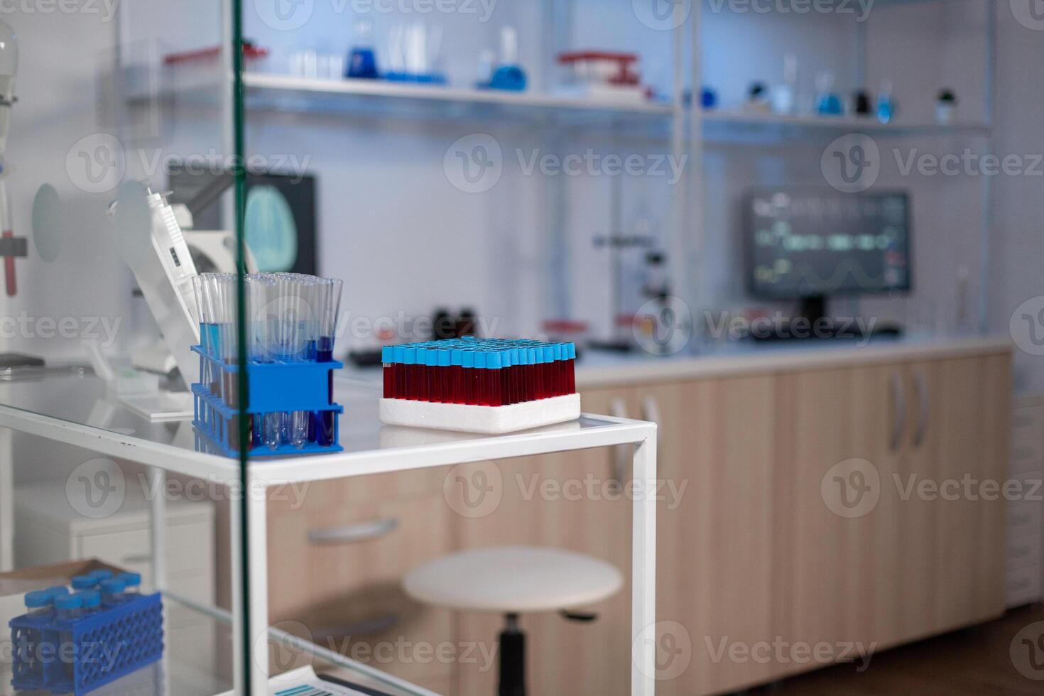 Empty medical neurological laboratory with nobody in it with professional modern equipment ready for neuroscience experiment. Lab with brain research on monitor. Medicine industry with high tech photo