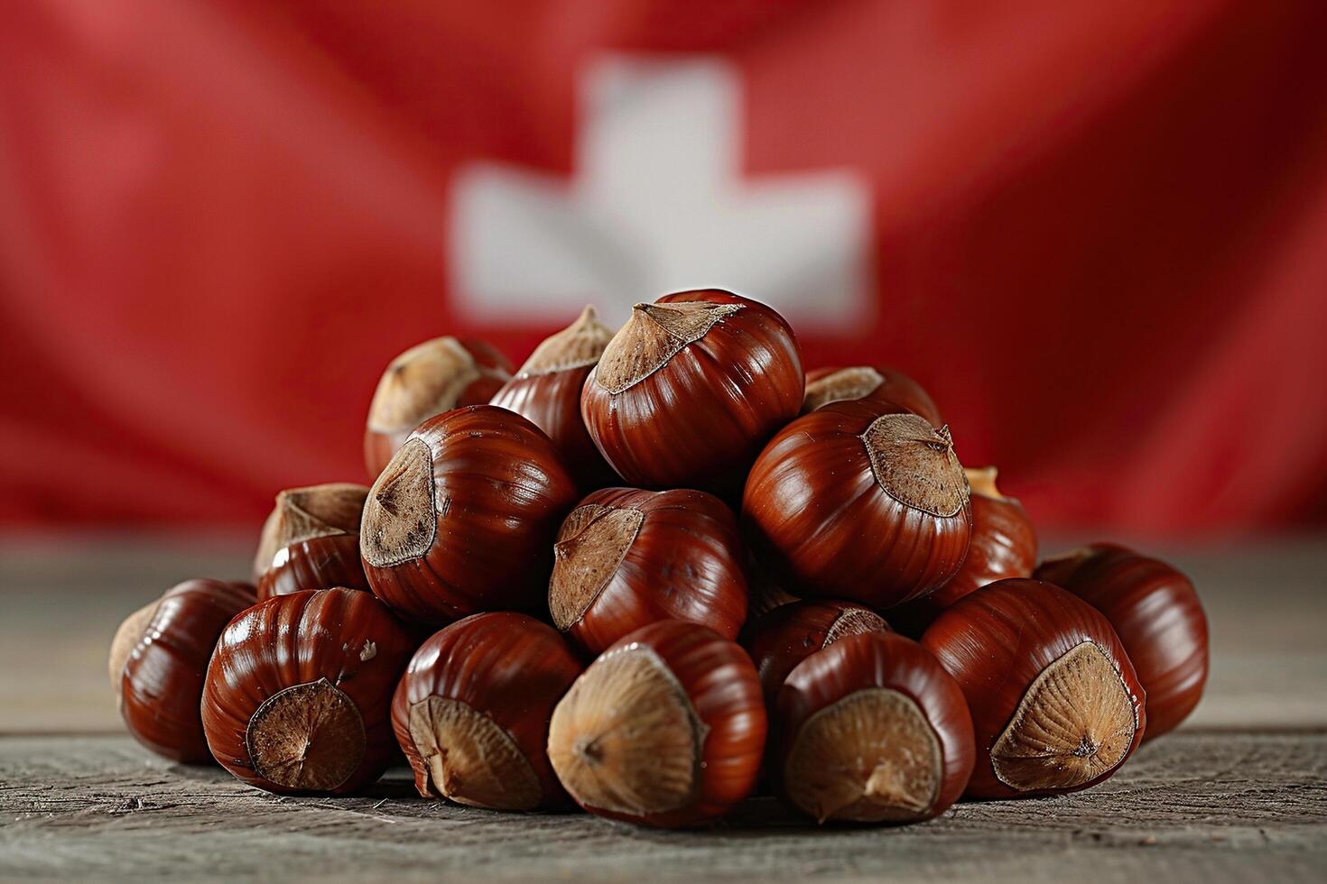 A bunch of chestnuts on wood against the background of the Swiss flag. Generated by artificial intelligence photo