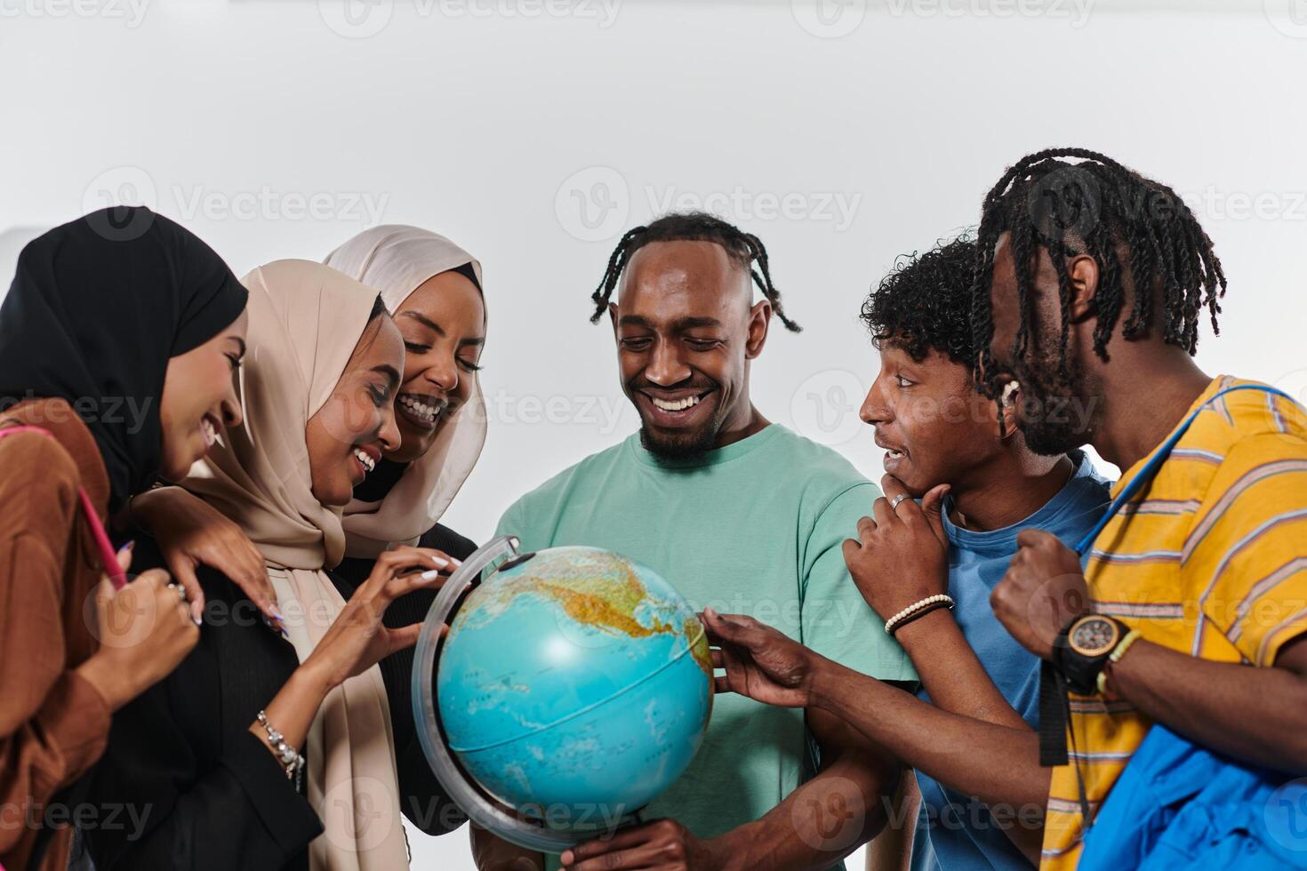 A diverse group of students is gathered around a globe, engrossed in exploration and study, their vibrant energy captured against a pristine white background, symbolizing unity and curiosity in their photo