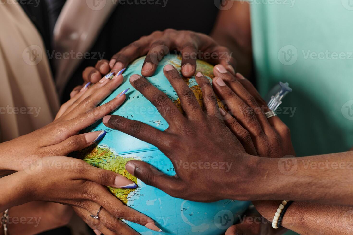 Close up of diverse teenagers' hands delicately exploring a globe, capturing the essence of curiosity and exploration in their tactile engagement with geographical knowledge photo