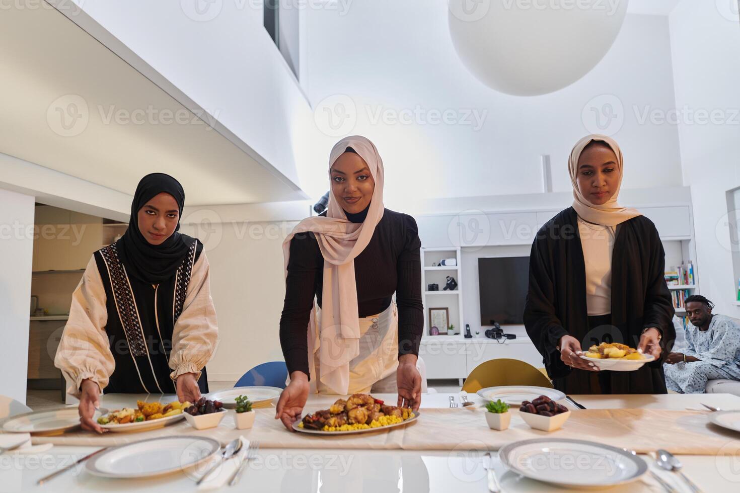 Group of young Arab women come together to lovingly prepare an iftar table during the sacred Muslim month of Ramadan, embodying the essence of communal unity, cultural tradition, and joyous photo