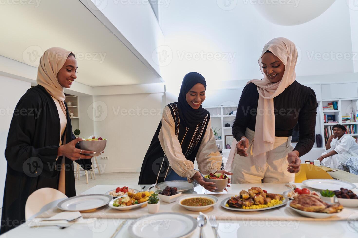 Group of young Arab women come together to lovingly prepare an iftar table during the sacred Muslim month of Ramadan, embodying the essence of communal unity, cultural tradition, and joyous photo