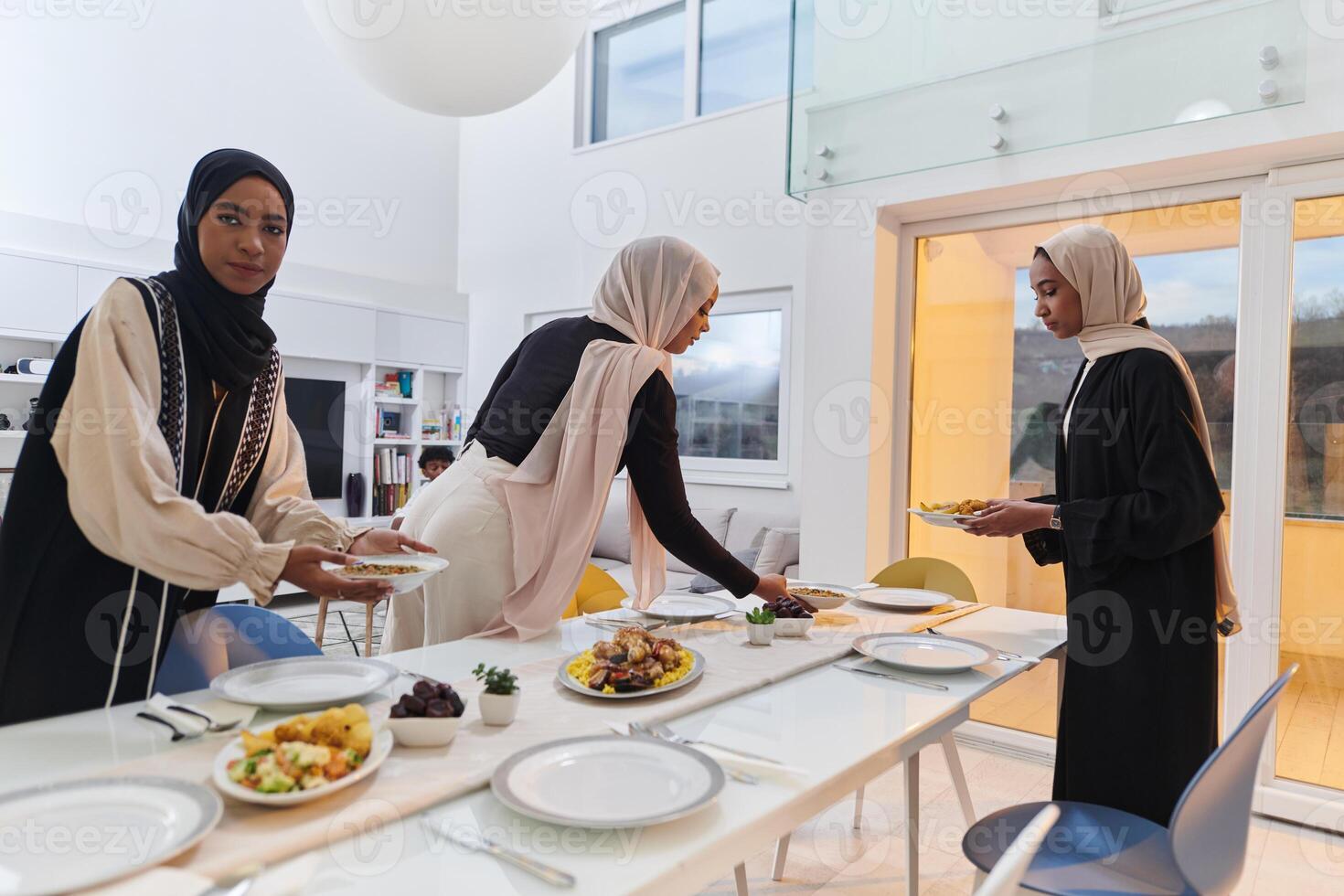 Group of young Arab women come together to lovingly prepare an iftar table during the sacred Muslim month of Ramadan, embodying the essence of communal unity, cultural tradition, and joyous photo
