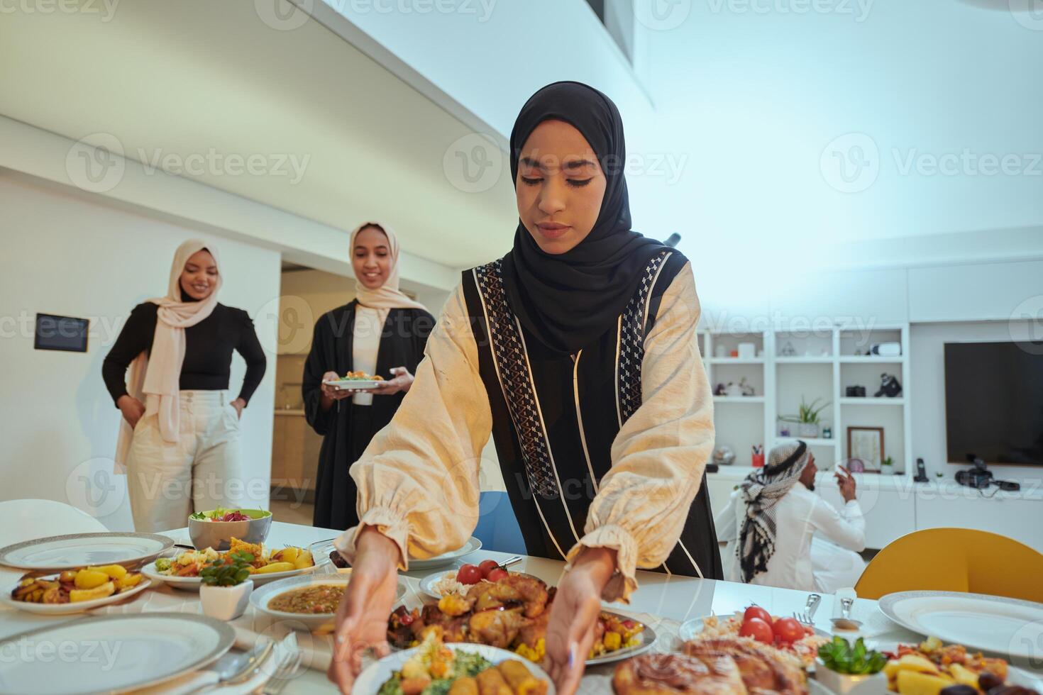 Group of young Arab women come together to lovingly prepare an iftar table during the sacred Muslim month of Ramadan, embodying the essence of communal unity, cultural tradition, and joyous photo