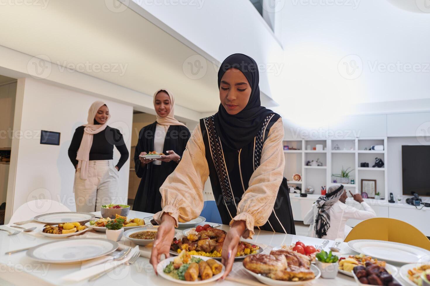Group of young Arab women come together to lovingly prepare an iftar table during the sacred Muslim month of Ramadan, embodying the essence of communal unity, cultural tradition, and joyous photo