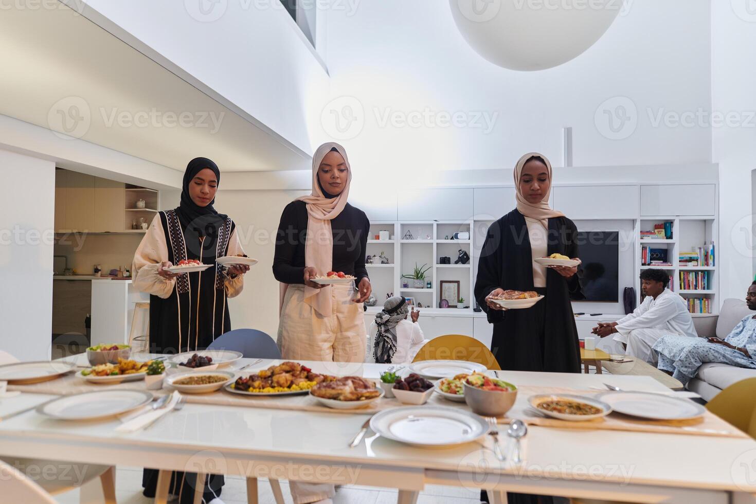 Group of young Arab women come together to lovingly prepare an iftar table during the sacred Muslim month of Ramadan, embodying the essence of communal unity, cultural tradition, and joyous photo