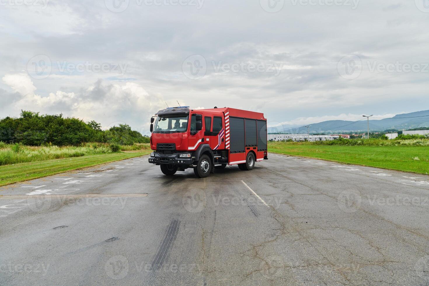 In this captivating scene, a state-of-the-art firetruck, equipped with advanced rescue technology, stands ready with its skilled firefighting team, prepared to intervene and respond rapidly to photo