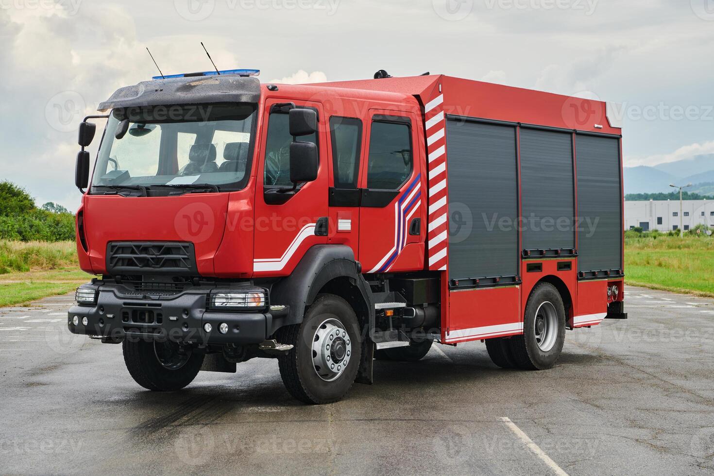 In this captivating scene, a state-of-the-art firetruck, equipped with advanced rescue technology, stands ready with its skilled firefighting team, prepared to intervene and respond rapidly to photo