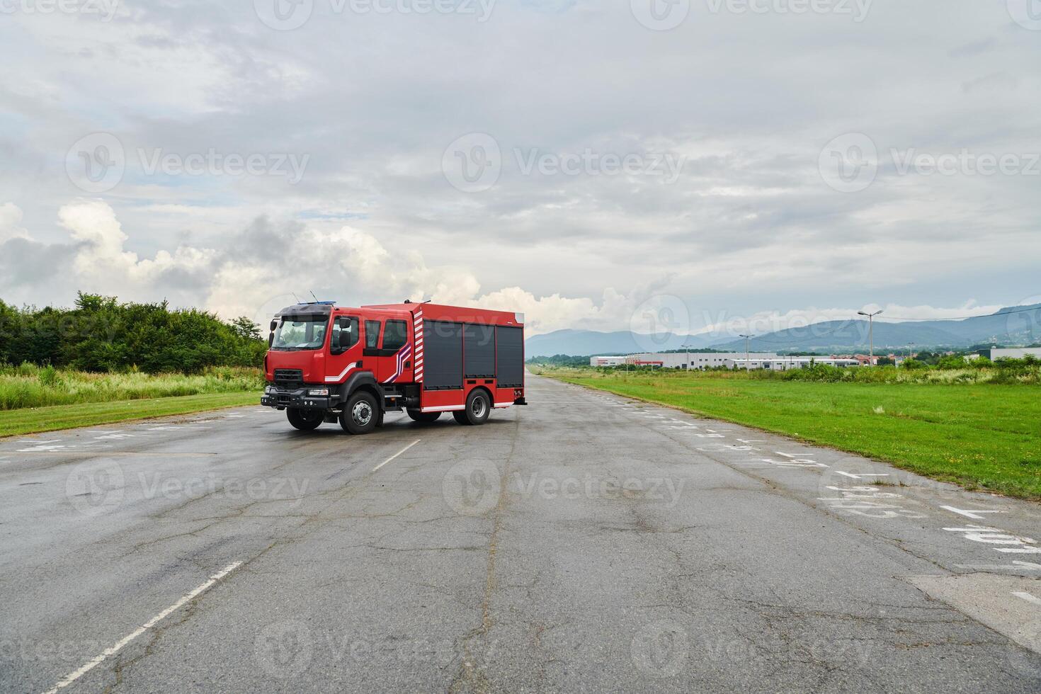In this captivating scene, a state-of-the-art firetruck, equipped with advanced rescue technology, stands ready with its skilled firefighting team, prepared to intervene and respond rapidly to photo