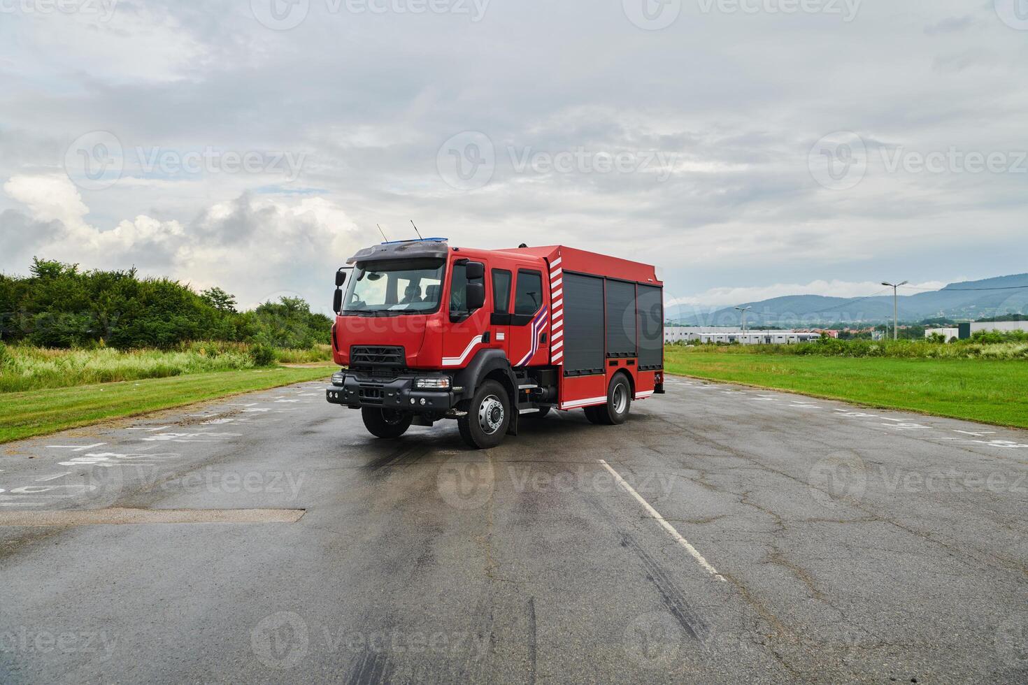 In this captivating scene, a state-of-the-art firetruck, equipped with advanced rescue technology, stands ready with its skilled firefighting team, prepared to intervene and respond rapidly to photo