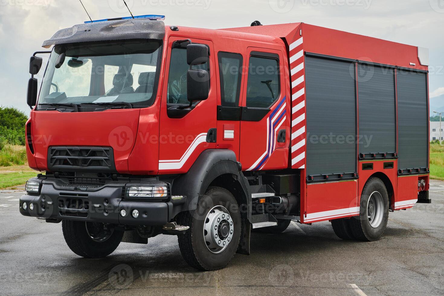 In this captivating scene, a state-of-the-art firetruck, equipped with advanced rescue technology, stands ready with its skilled firefighting team, prepared to intervene and respond rapidly to photo