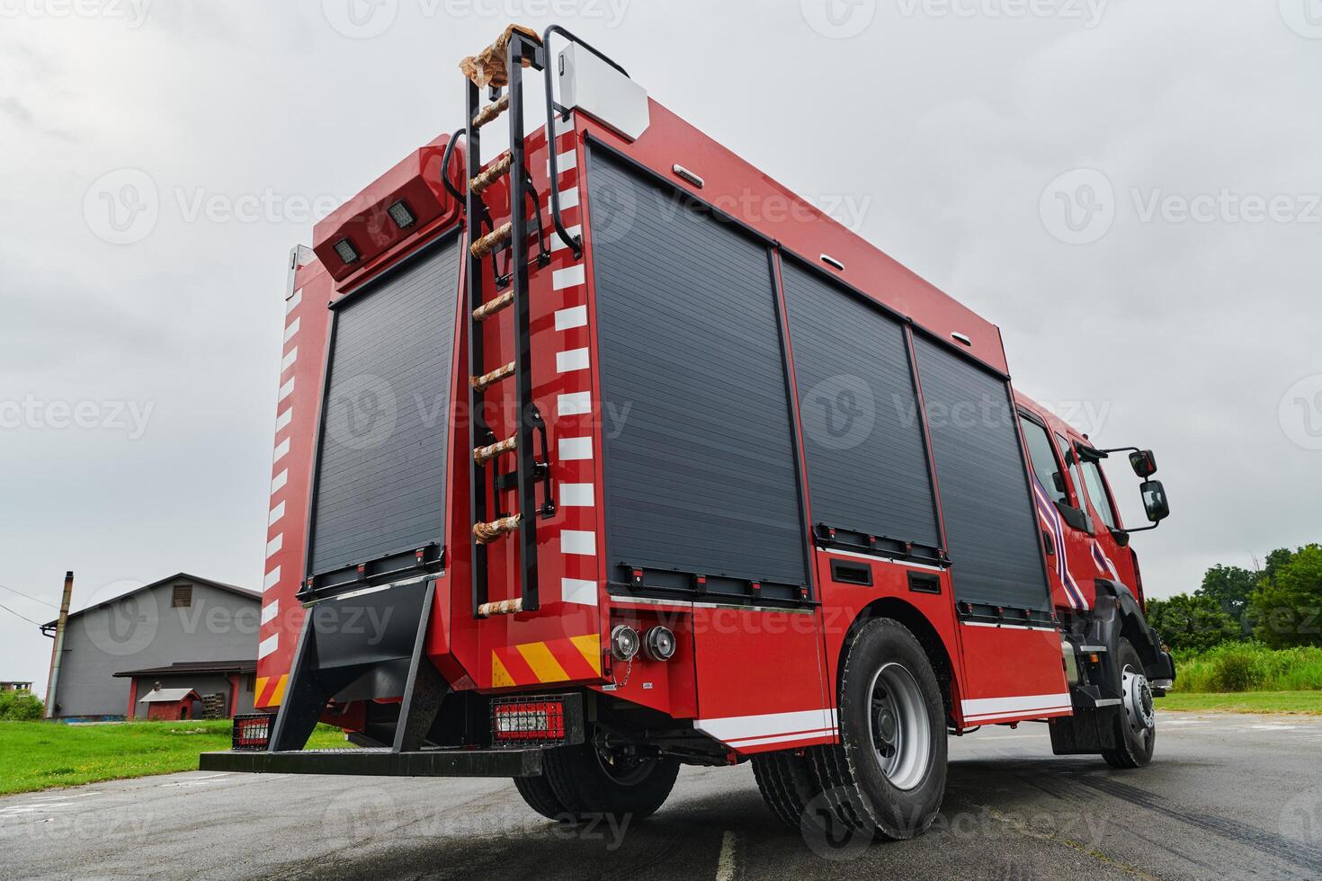 In this captivating scene, a state-of-the-art firetruck, equipped with advanced rescue technology, stands ready with its skilled firefighting team, prepared to intervene and respond rapidly to photo