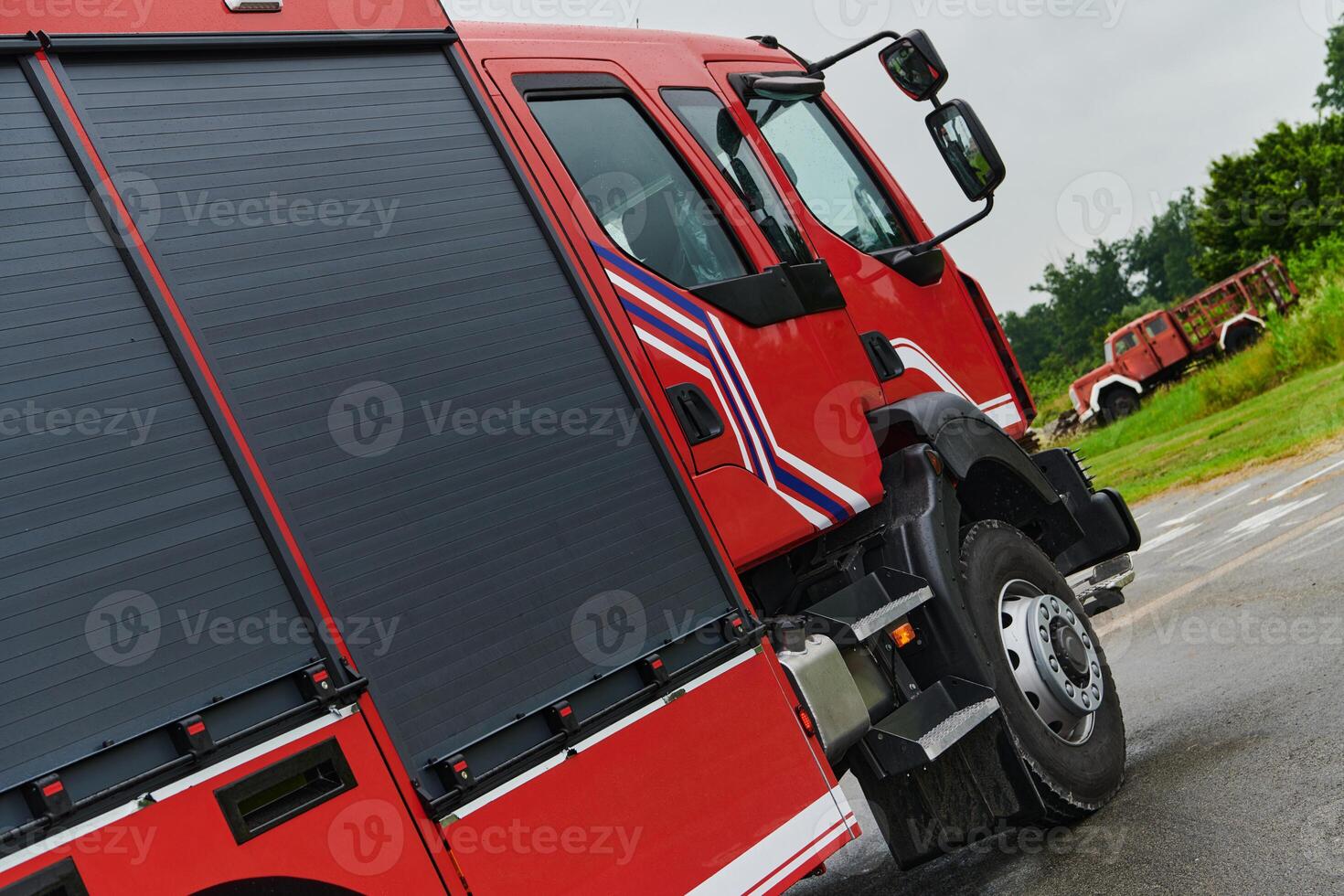 In this captivating scene, a state-of-the-art firetruck, equipped with advanced rescue technology, stands ready with its skilled firefighting team, prepared to intervene and respond rapidly to photo