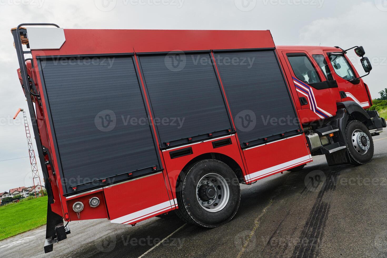 In this captivating scene, a state-of-the-art firetruck, equipped with advanced rescue technology, stands ready with its skilled firefighting team, prepared to intervene and respond rapidly to photo