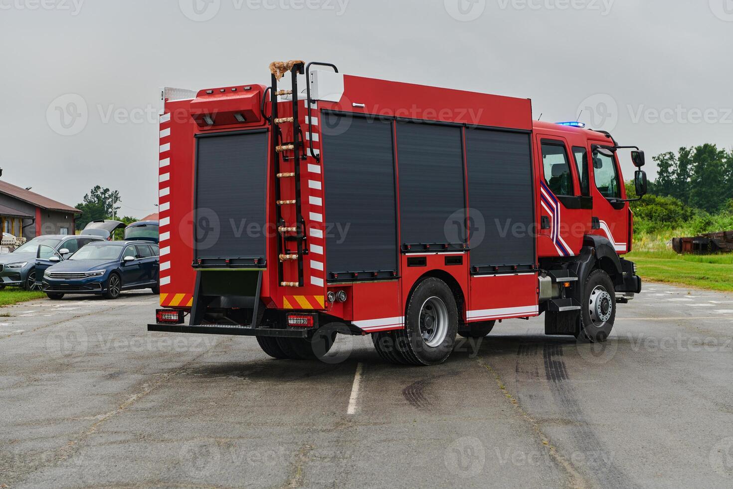 In this captivating scene, a state-of-the-art firetruck, equipped with advanced rescue technology, stands ready with its skilled firefighting team, prepared to intervene and respond rapidly to photo
