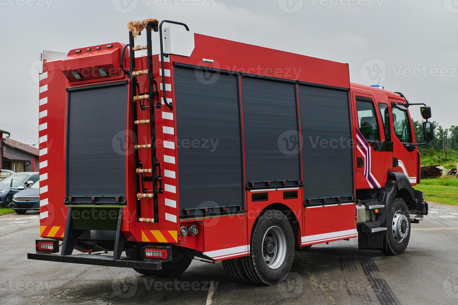 In this captivating scene, a state-of-the-art firetruck, equipped with advanced rescue technology, stands ready with its skilled firefighting team, prepared to intervene and respond rapidly to photo