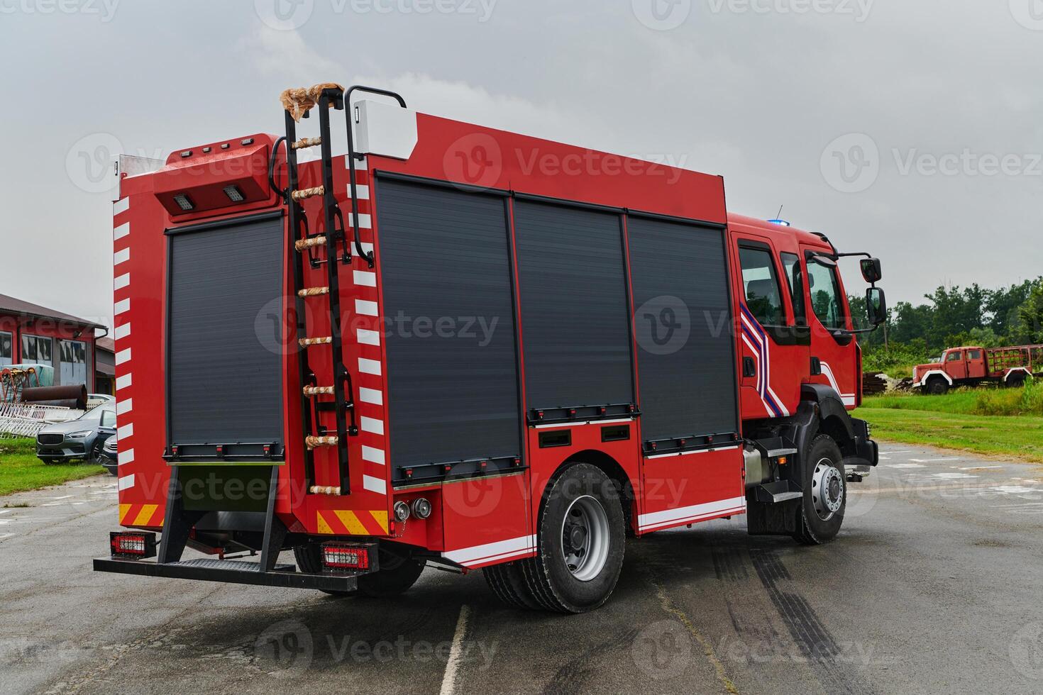 In this captivating scene, a state-of-the-art firetruck, equipped with advanced rescue technology, stands ready with its skilled firefighting team, prepared to intervene and respond rapidly to photo