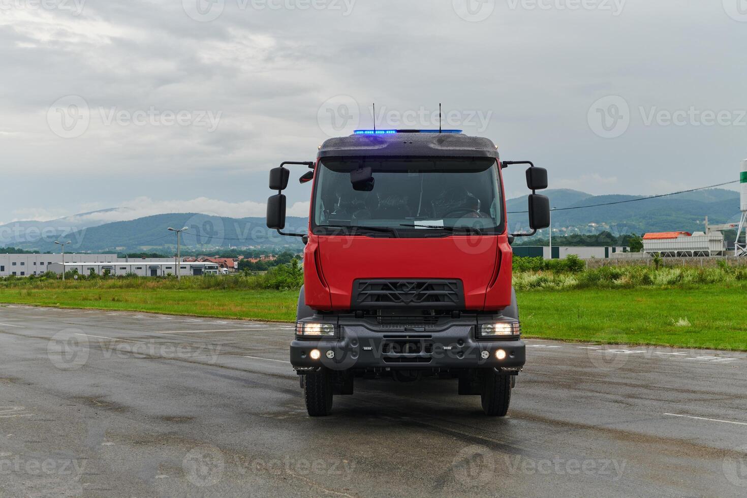 In this captivating scene, a state-of-the-art firetruck, equipped with advanced rescue technology, stands ready with its skilled firefighting team, prepared to intervene and respond rapidly to photo
