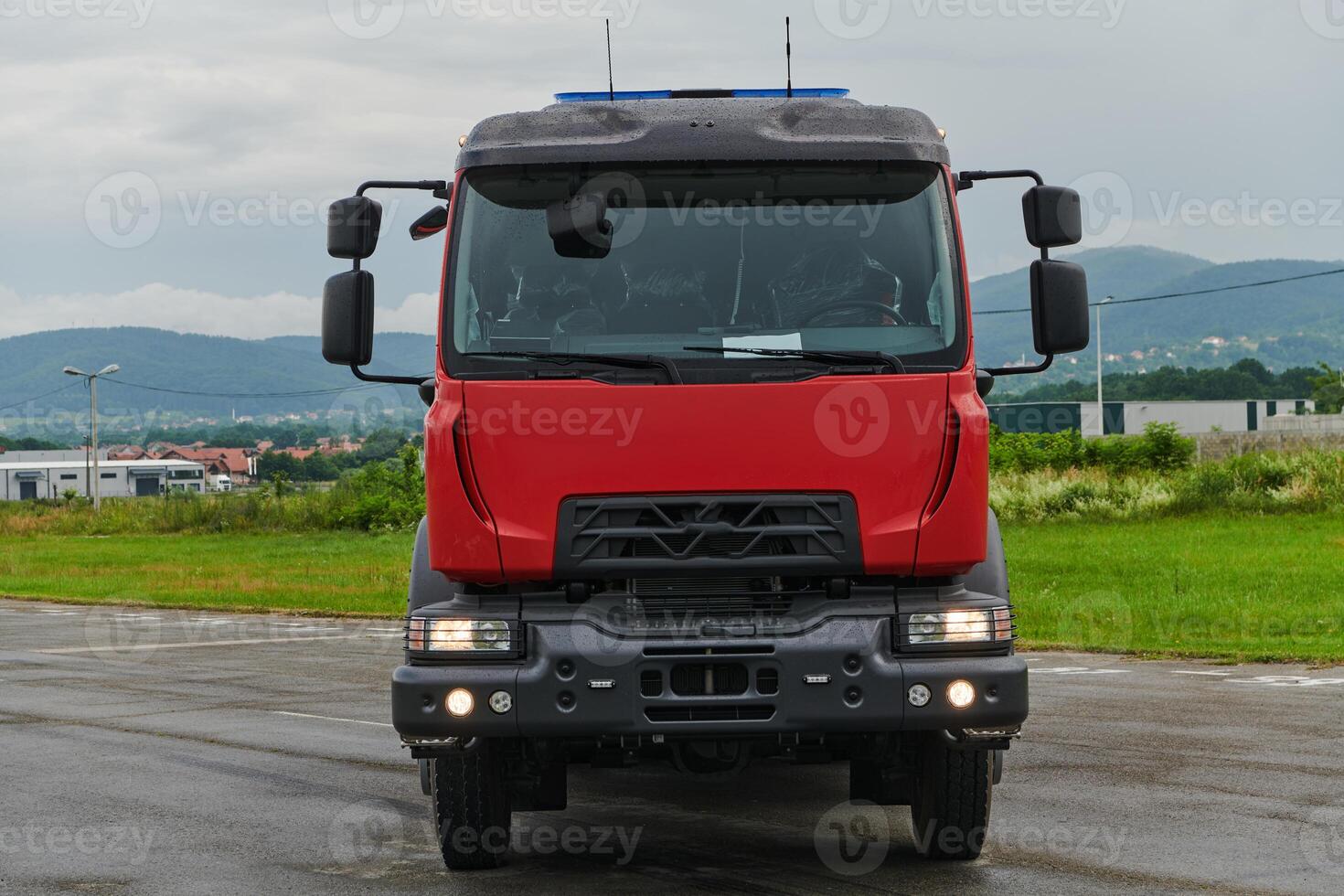 In this captivating scene, a state-of-the-art firetruck, equipped with advanced rescue technology, stands ready with its skilled firefighting team, prepared to intervene and respond rapidly to photo