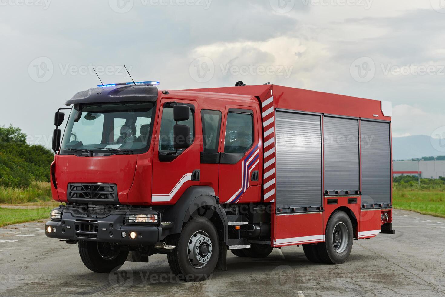 In this captivating scene, a state-of-the-art firetruck, equipped with advanced rescue technology, stands ready with its skilled firefighting team, prepared to intervene and respond rapidly to photo
