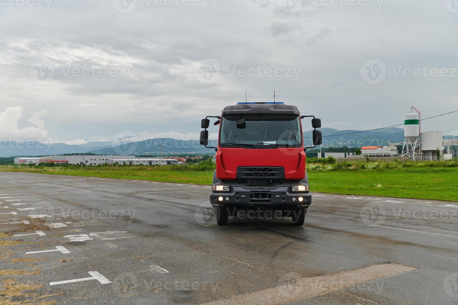 In this captivating scene, a state-of-the-art firetruck, equipped with advanced rescue technology, stands ready with its skilled firefighting team, prepared to intervene and respond rapidly to photo