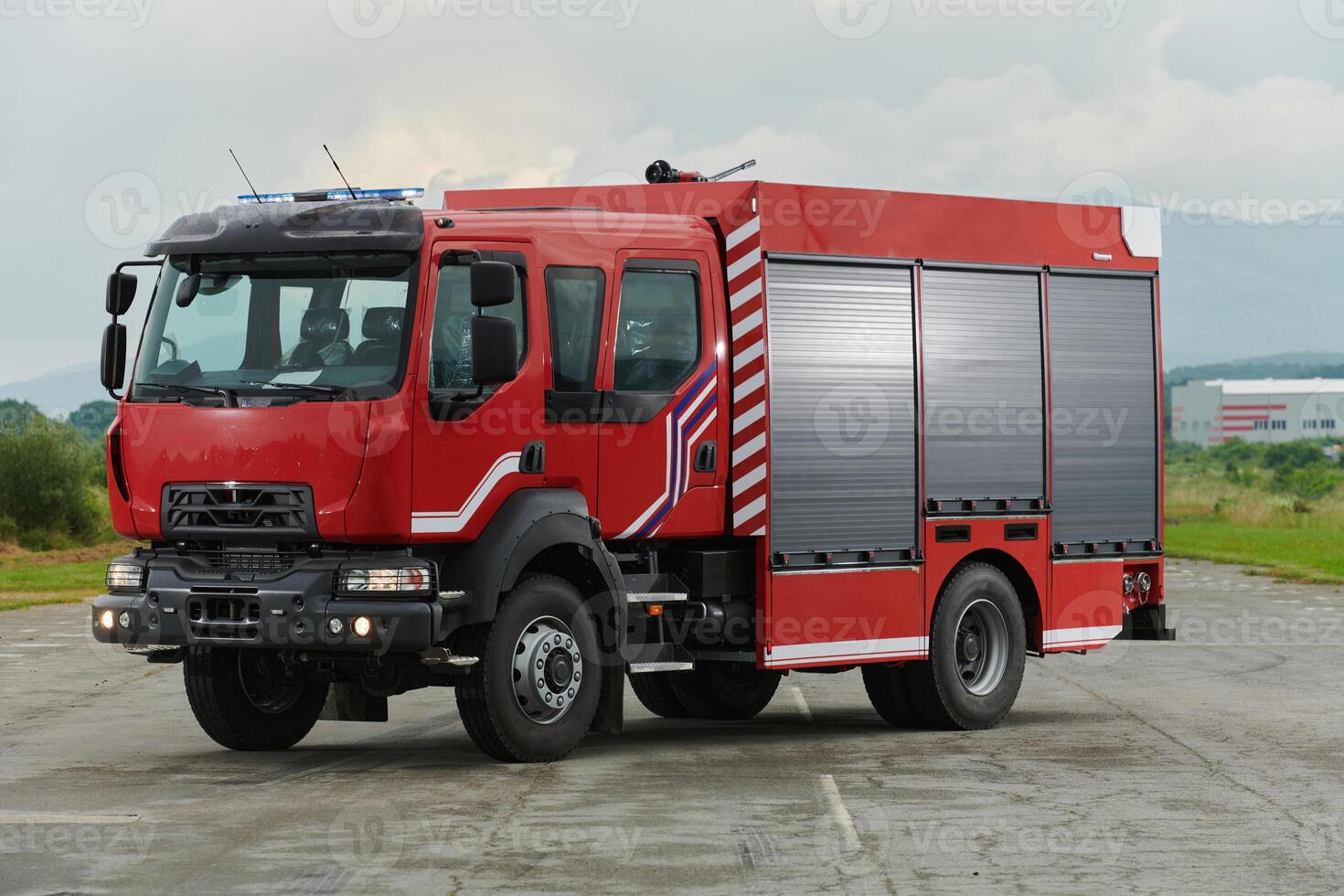 In this captivating scene, a state-of-the-art firetruck, equipped with advanced rescue technology, stands ready with its skilled firefighting team, prepared to intervene and respond rapidly to photo