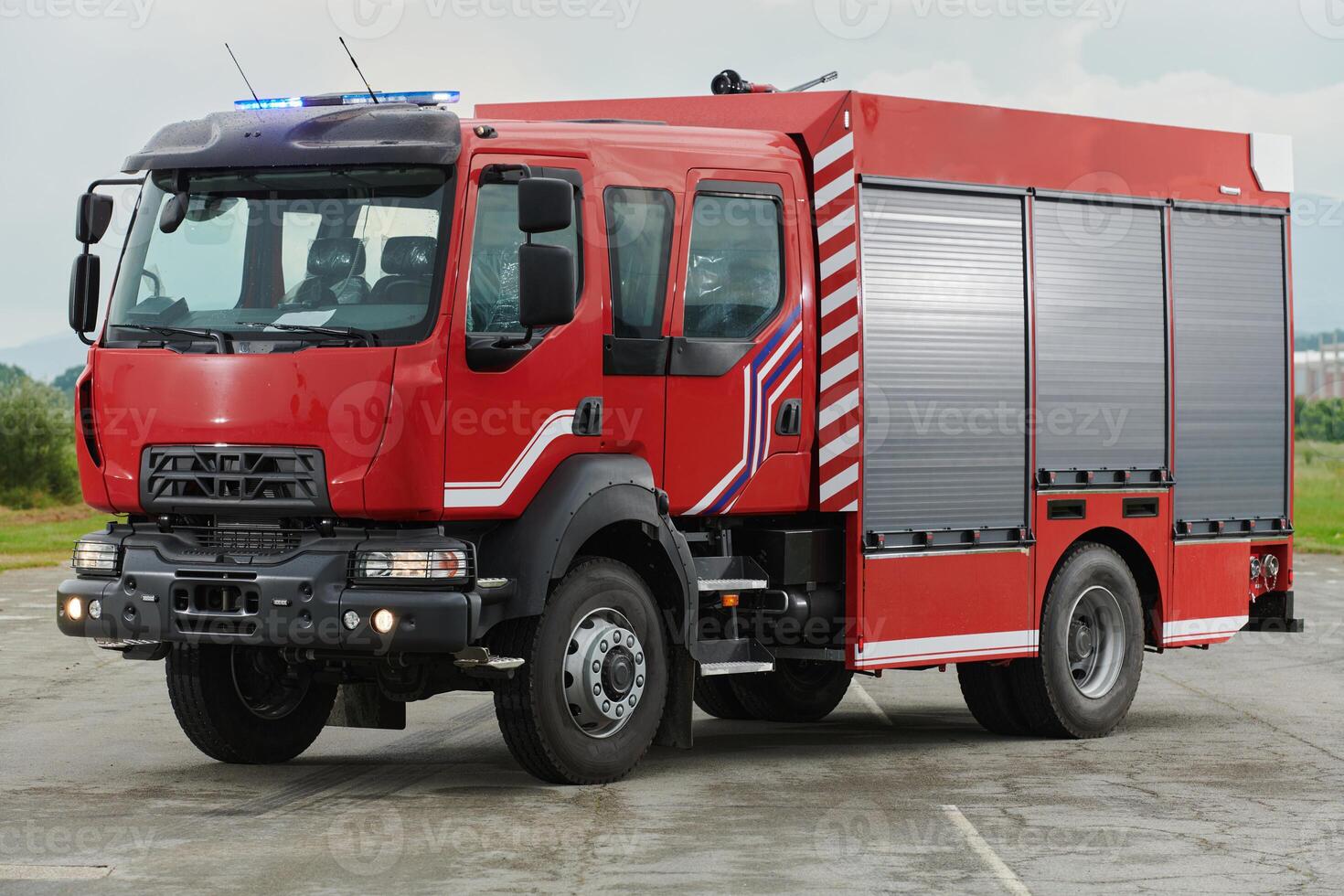 In this captivating scene, a state-of-the-art firetruck, equipped with advanced rescue technology, stands ready with its skilled firefighting team, prepared to intervene and respond rapidly to photo