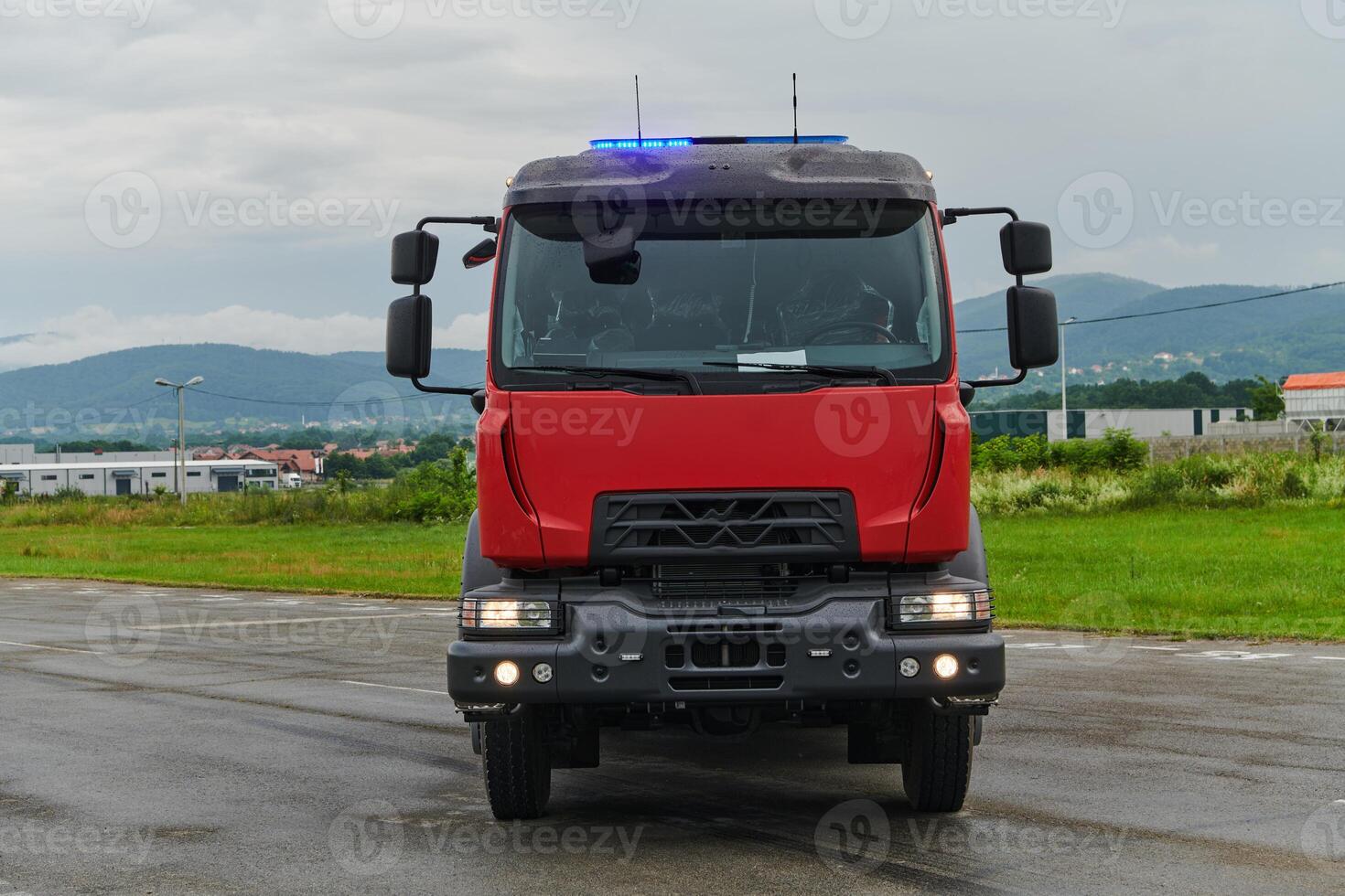 In this captivating scene, a state-of-the-art firetruck, equipped with advanced rescue technology, stands ready with its skilled firefighting team, prepared to intervene and respond rapidly to photo