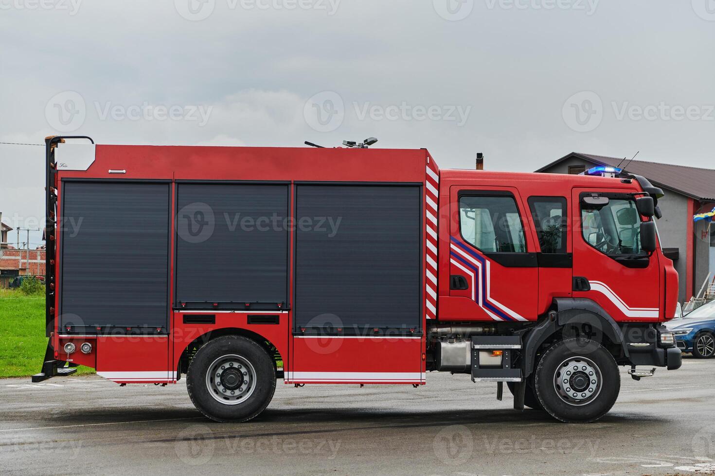 In this captivating scene, a state-of-the-art firetruck, equipped with advanced rescue technology, stands ready with its skilled firefighting team, prepared to intervene and respond rapidly to photo