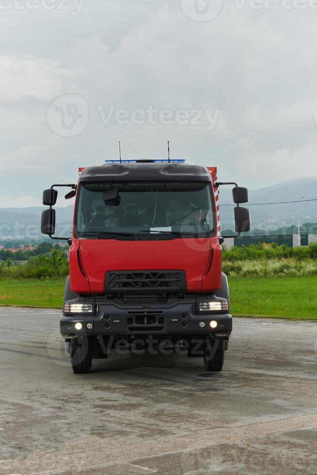 In this captivating scene, a state-of-the-art firetruck, equipped with advanced rescue technology, stands ready with its skilled firefighting team, prepared to intervene and respond rapidly to photo