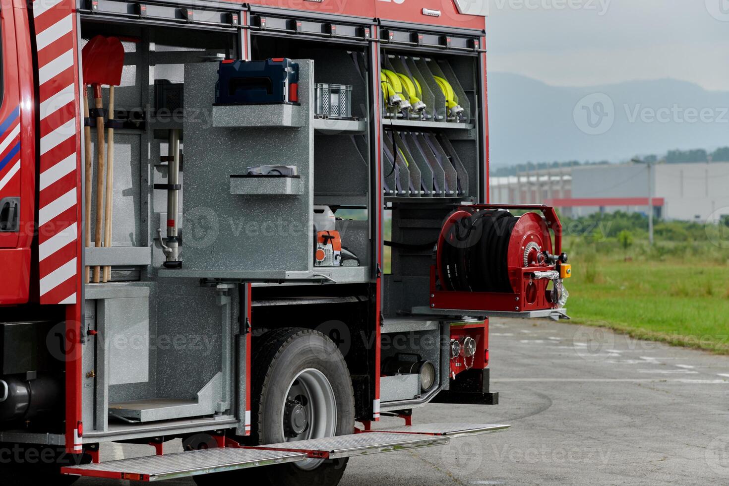 In this detailed close-up, a high-tech rescue tool, meticulously organized within state-of-the-art firefighting vehicles, showcases precision and innovation in life-saving equipment, emphasizing the photo