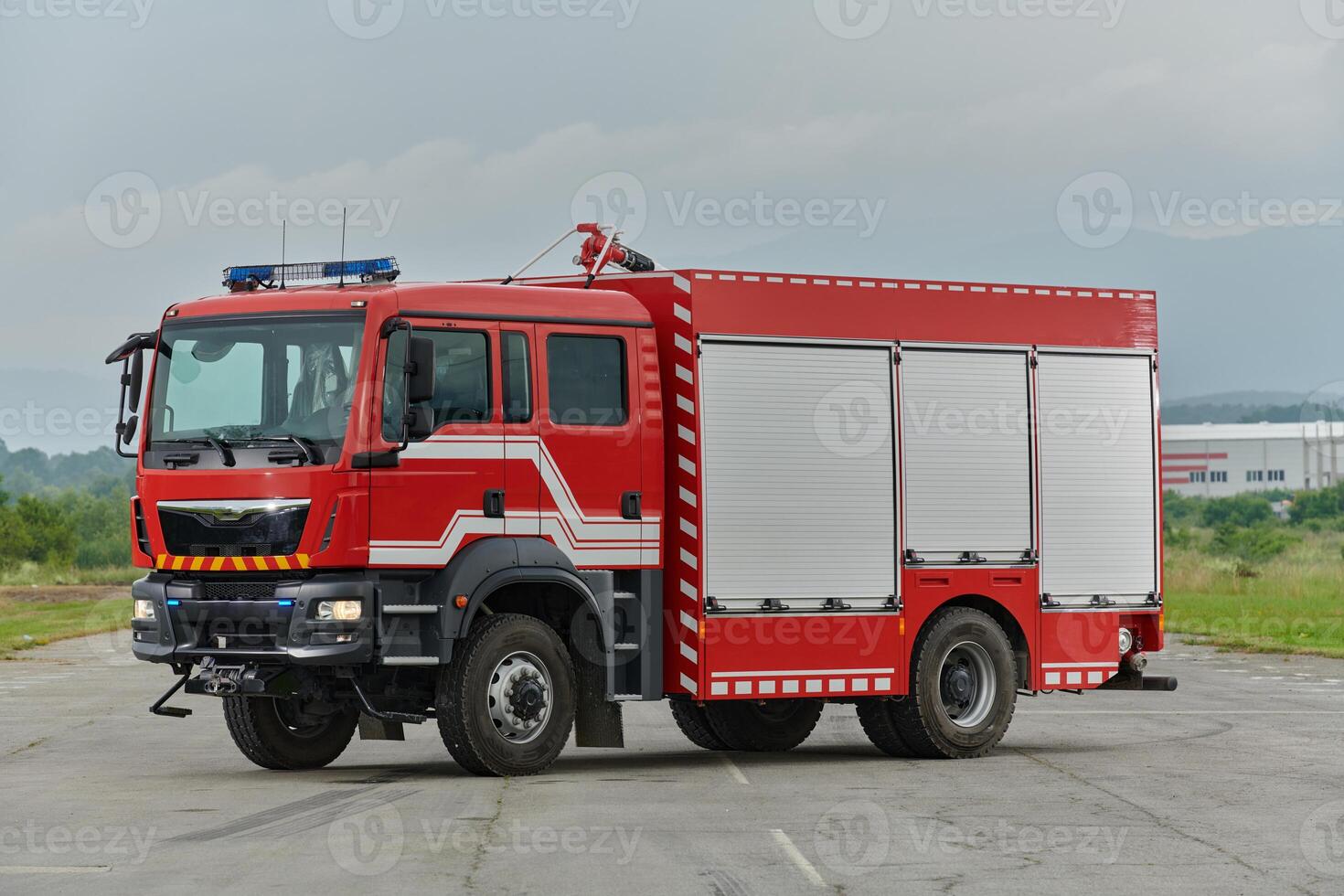 In this captivating scene, a state-of-the-art firetruck, equipped with advanced rescue technology, stands ready with its skilled firefighting team, prepared to intervene and respond rapidly to photo