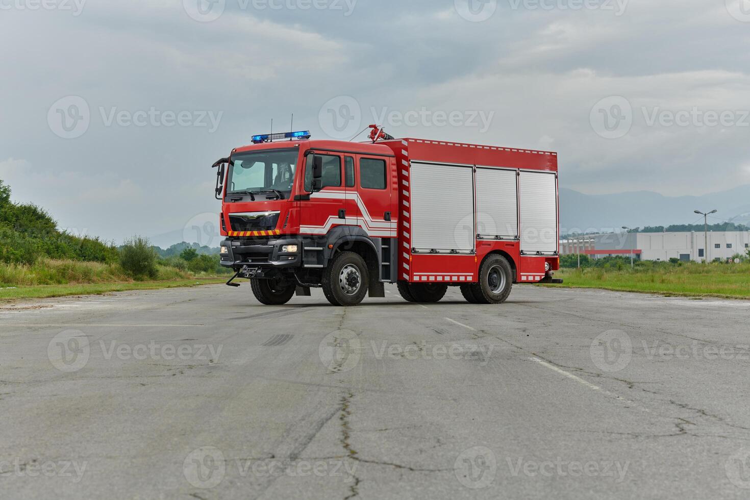 In this captivating scene, a state-of-the-art firetruck, equipped with advanced rescue technology, stands ready with its skilled firefighting team, prepared to intervene and respond rapidly to photo