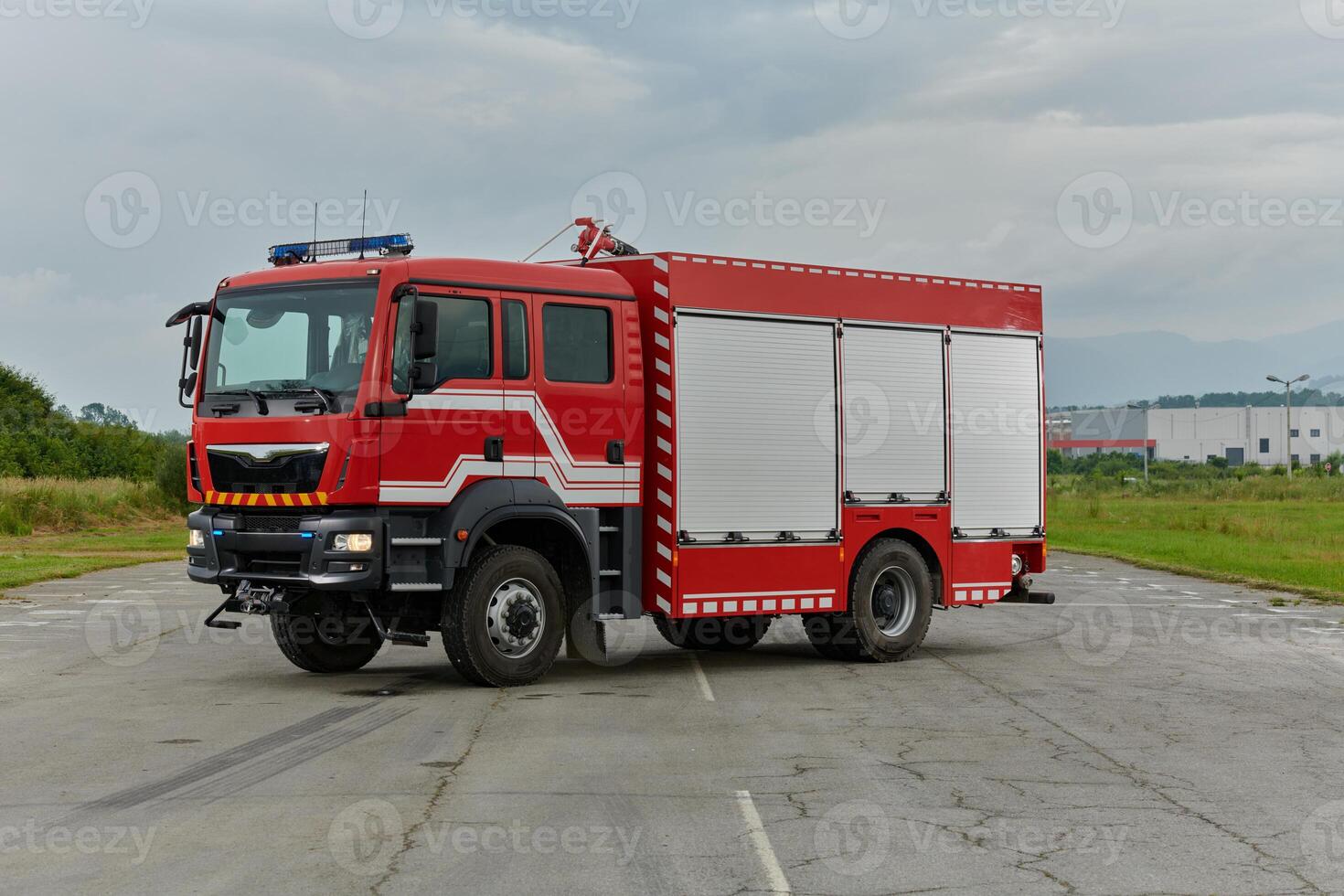In this captivating scene, a state-of-the-art firetruck, equipped with advanced rescue technology, stands ready with its skilled firefighting team, prepared to intervene and respond rapidly to photo
