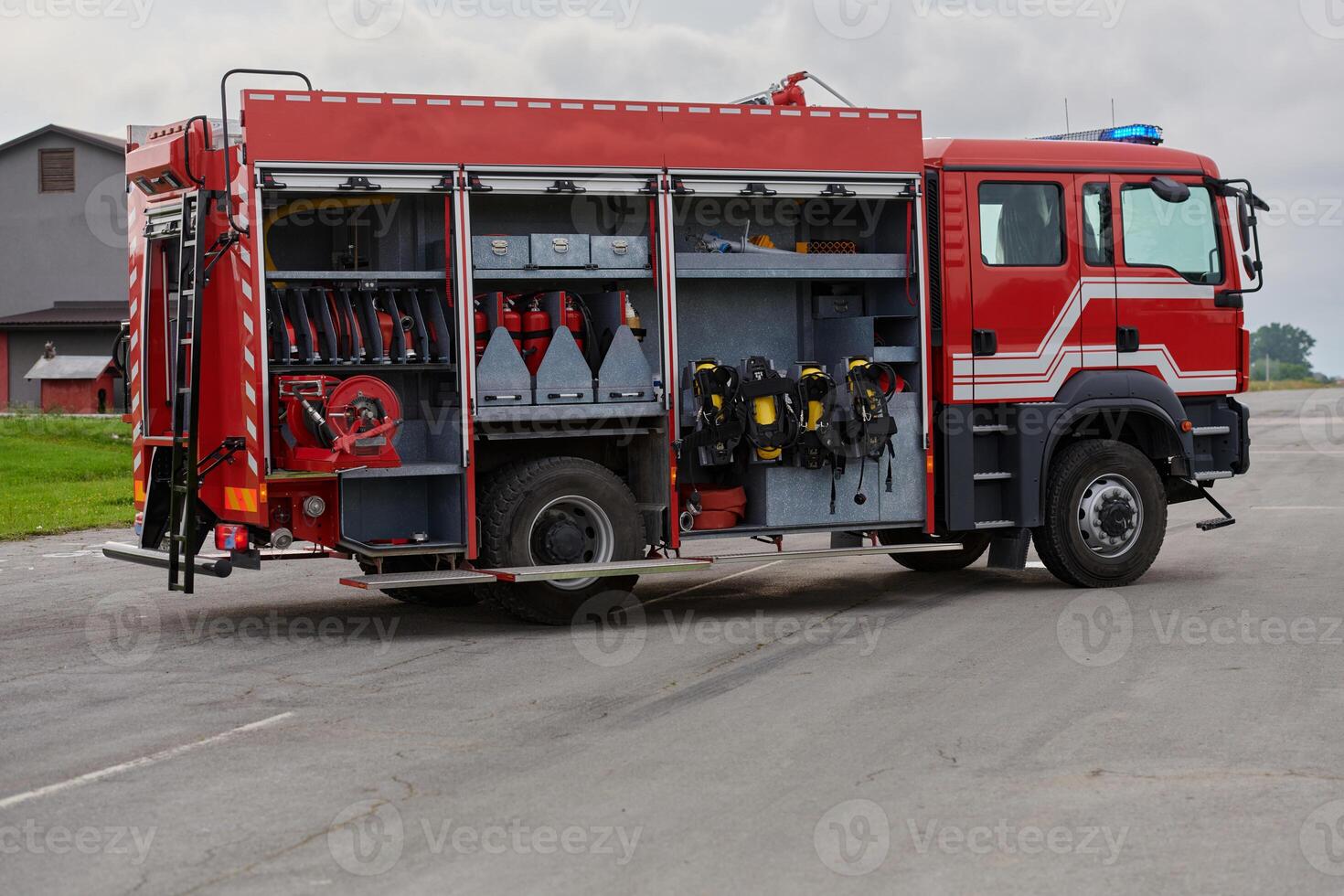 In this captivating scene, a state-of-the-art firetruck, equipped with advanced rescue technology, stands ready with its skilled firefighting team, prepared to intervene and respond rapidly to photo