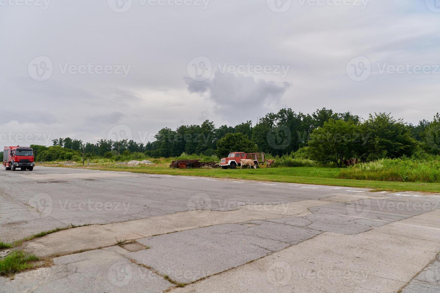 In this captivating scene, a state-of-the-art firetruck, equipped with advanced rescue technology, stands ready with its skilled firefighting team, prepared to intervene and respond rapidly to photo