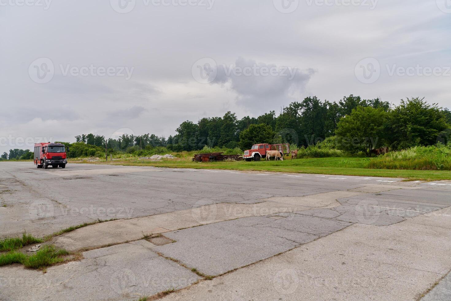 In this captivating scene, a state-of-the-art firetruck, equipped with advanced rescue technology, stands ready with its skilled firefighting team, prepared to intervene and respond rapidly to photo