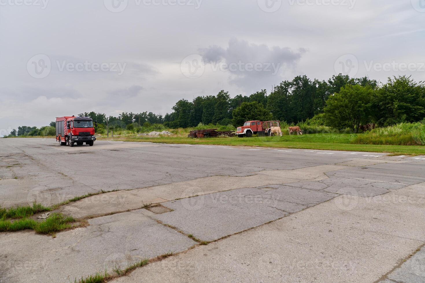 In this captivating scene, a state-of-the-art firetruck, equipped with advanced rescue technology, stands ready with its skilled firefighting team, prepared to intervene and respond rapidly to photo